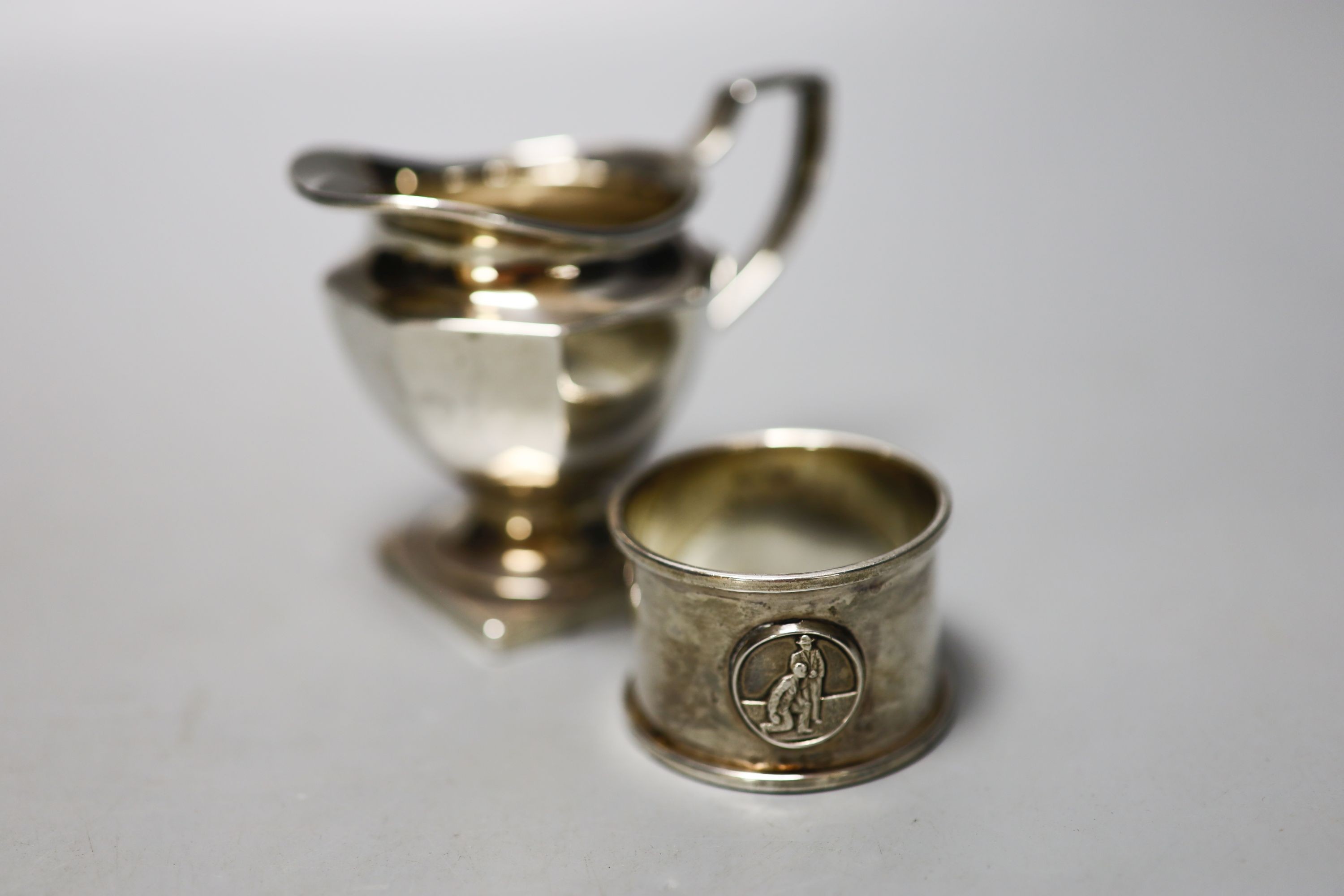 A pair of Victorian silver bun salts, London, 1859, two silver spoons, two mounted whisky tot jug (one a.f.), a silver cream jug, a silver napkin ring and a silver two handled pot and cover.